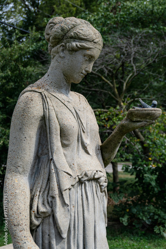 Statue of woman holding a bird