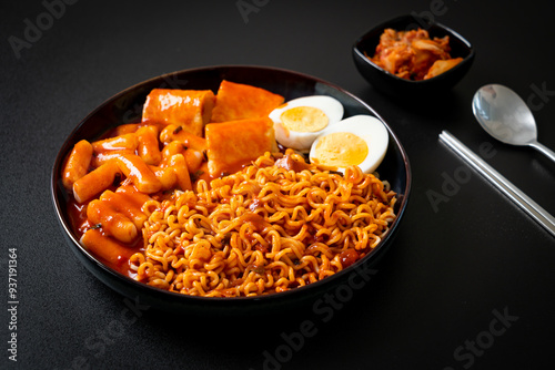 Korean instant noodles with Korean rice cake and fish cake and boiled egg photo