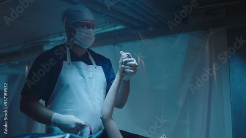 Mortician measuring the body parts