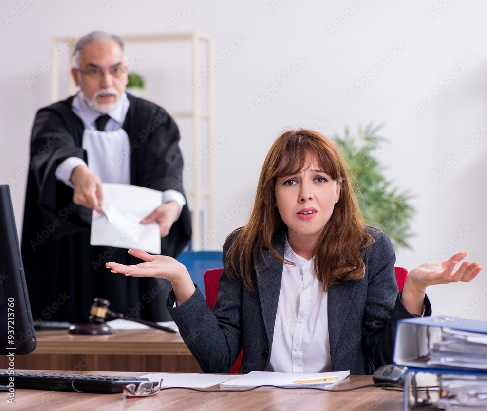 Φωτογραφία Old male judge and his young secretary in the office