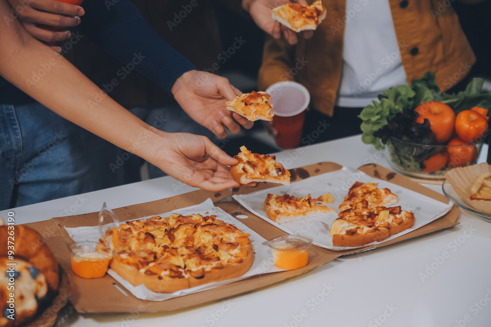 Group of young friends eating pizza.Home party. Group of young friends eating pizza.Home party.