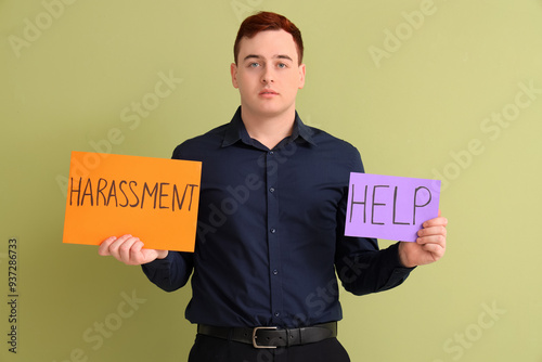 Businessman holding papers ...