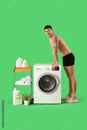 Young man in underpants doi...