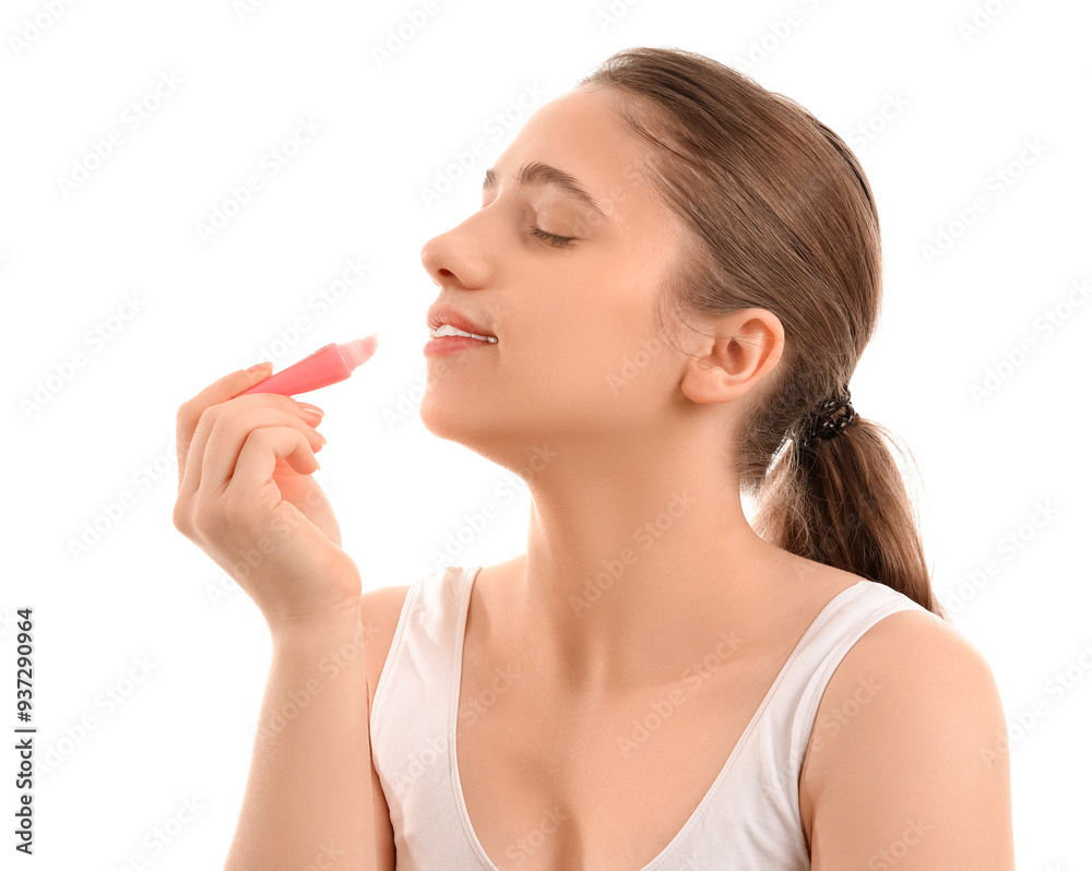 Young woman applying lip balm on white background, closeup Young woman applying lip balm on white background, closeup