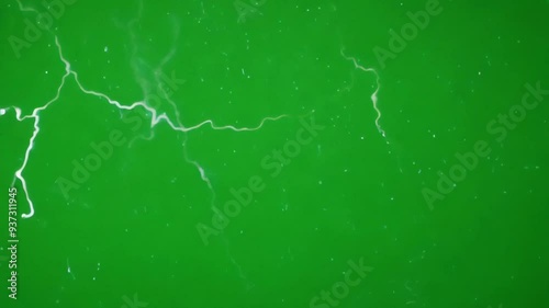lightning flashing across a green screen