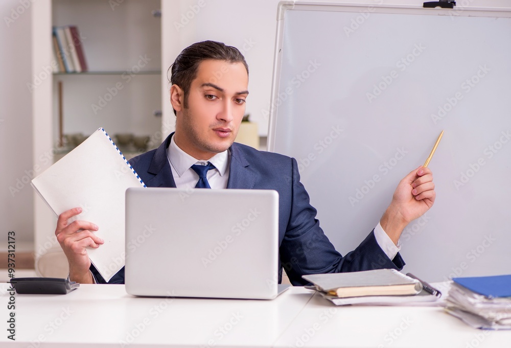 Young male employee working at home during pandemic disease Young male employee working at home during pandemic disease