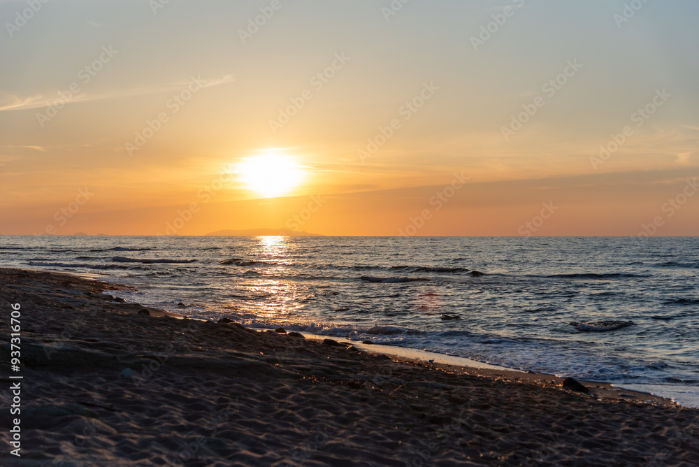 Obraz premium Beautiful scenic sunset over mediterranean sea, seen from the Valledoria beach, Sardinia, Italy. 