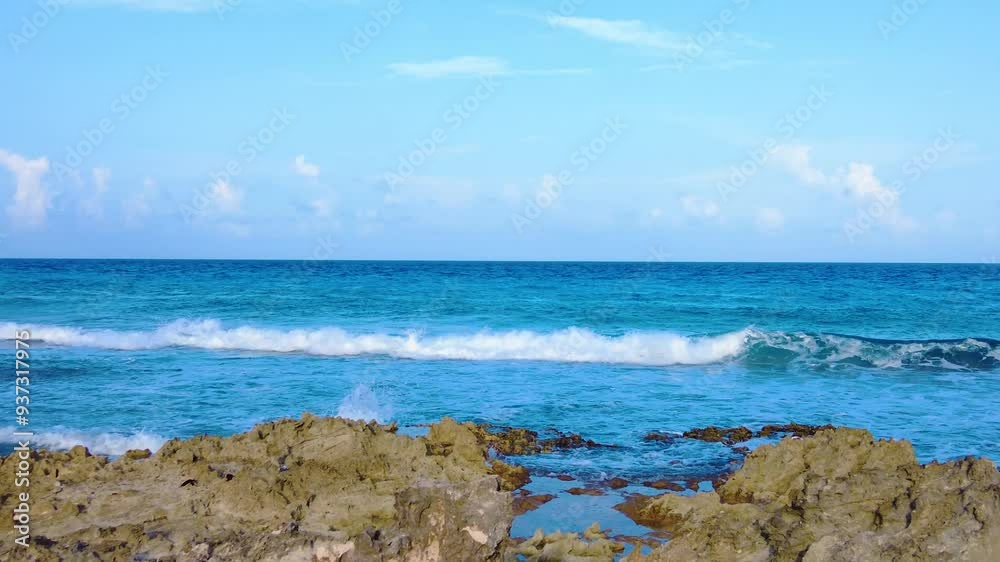 Stunning sunset over the rocky shores of Playa Gaviota, Cancun, with Caribbean waves gently crashing against the coast Stunning sunset over the rocky shores of Playa Gaviota, Cancun, with Caribbean waves gently crashing against the coast