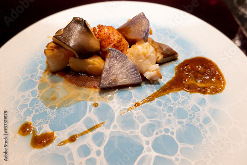 Luxury Japanese Dinner with grilled Fish, Seefood, roasted Radish, Japanese Daikon and Sauce on Plate, Omakase, prepared by Japanese Chef in Luxury Hotel Restaurant in the Kansai Region, Japan