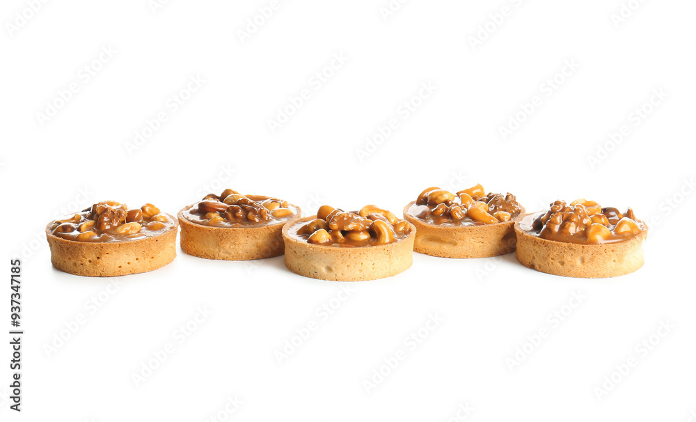 Tasty tarts with nuts and caramel isolated on white background Tasty tarts with nuts and caramel isolated on white background