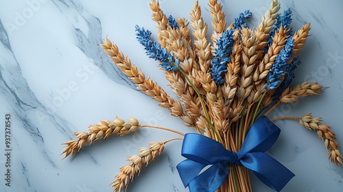 Golden wheat fields sway gently in the summer breeze, their ears ripe and ready for harvest photo