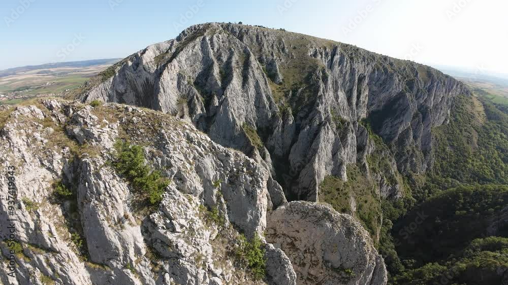 FPV drone descends into Cheile Turzii gorge, highlighting the rocky cliffs and scenic natural beauty of the area in Romania FPV drone descends into Cheile Turzii gorge, highlighting the rocky cliffs and scenic natural beauty of the area in Romania