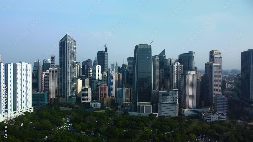Panoramic drone shot around the Makati skyline, in sunny Manila, Philippines Panoramic drone shot around the Makati skyline, in sunny Manila, Philippines