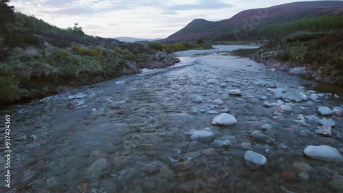 closeup of wide river full of stones, fly over aerial shot photo