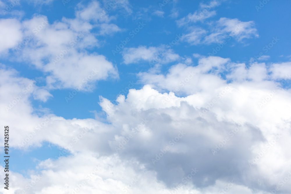 Fototapeta premium White clouds against a blue sky