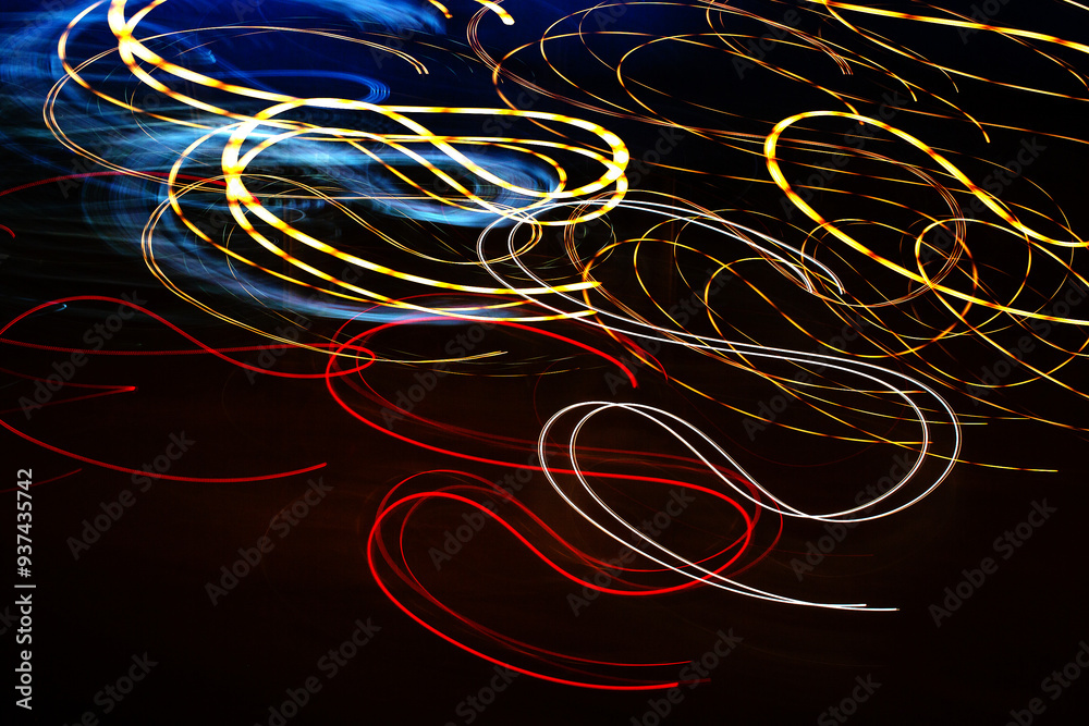 Abstract patterns of created during long camera exposures of artificial light sources at night Abstract patterns of created during long camera exposures of artificial light sources at night
