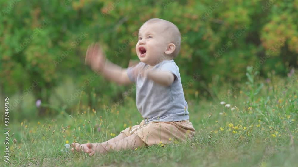 A young child seats in a field, surrounded by wildflowers and the warm glow of the setting sun. A young child seats in a field, surrounded by wildflowers and the warm glow of the setting sun.