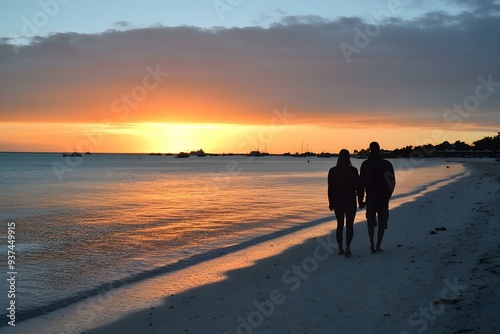 Couple Walking on Beach at Sunset