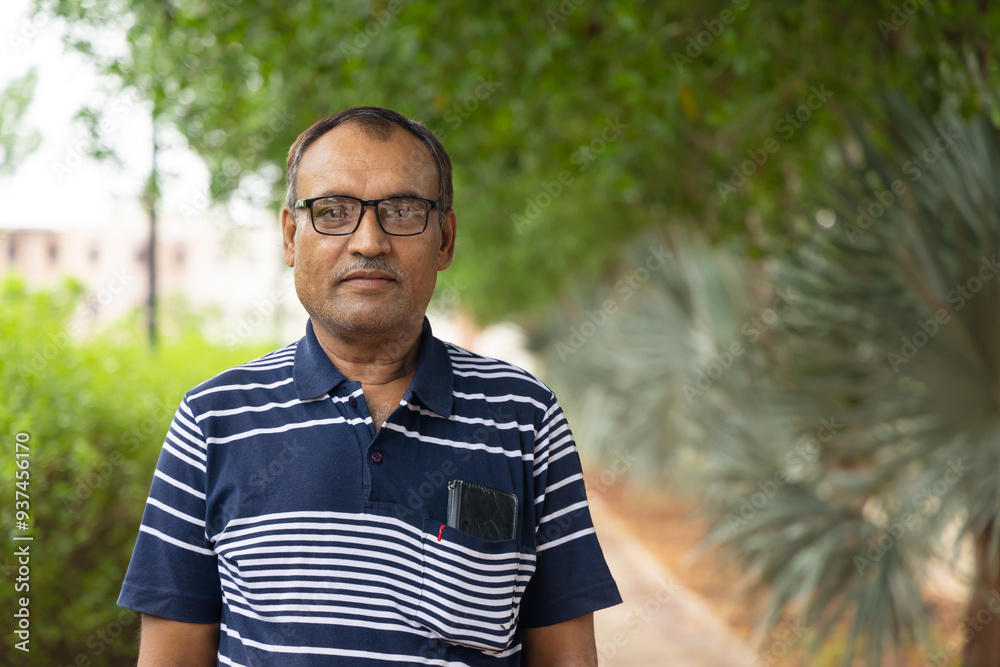 isolated smiling man facial expression at outdoor park at evening from flat angle isolated smiling man facial expression at outdoor park at evening from flat angle