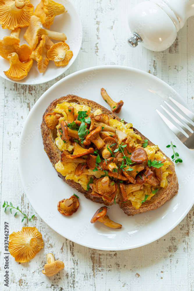 toast with fried chanterelle mushrooms and scrambled eggs toast with fried chanterelle mushrooms and scrambled eggs