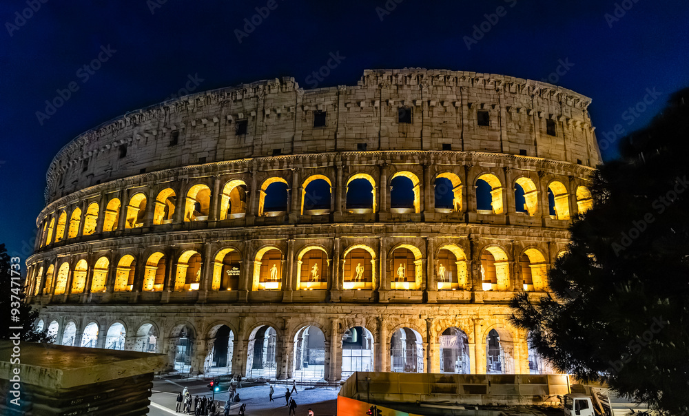 Naklejka premium Rome, Italy - April 09, 2024: View of the Roman Coliseum in Rome with tourists crowding its surroundings in Rome, Italy