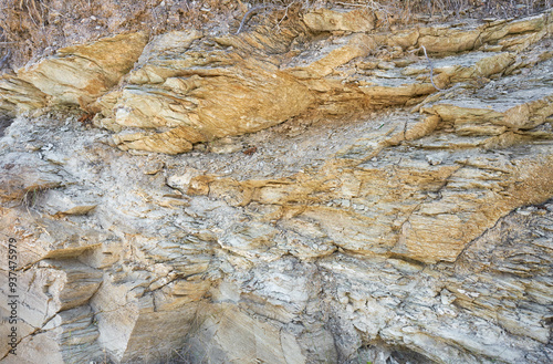 Background of mountain texture on Crete, Greece. Closeup on rocky, rugged cliff surface. photo