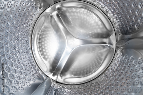 Close up internal view of an empty washing machine drum during wash