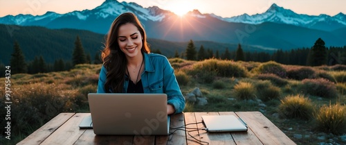 woman with laptop in the mountains