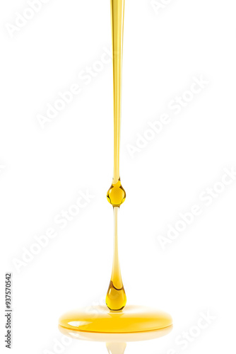 A single drop of yellow olive oil or oily cosmetic liquid suspended in the air against a white background, showcasing its glossy texture and fluidity. photo