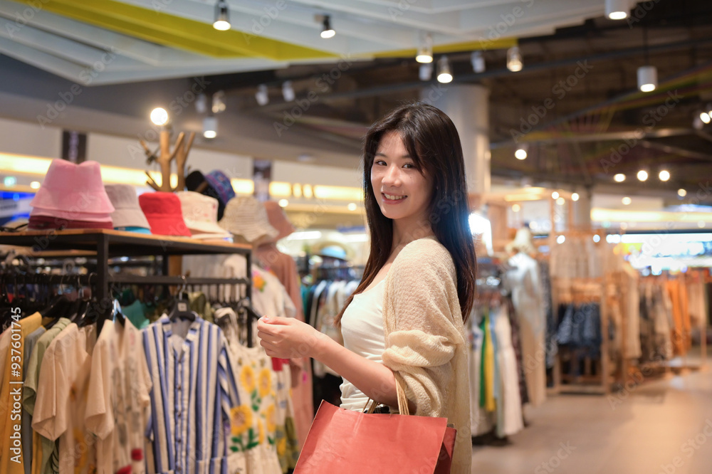 Beautiful asian female customer enjoy shopping in a local boutique store. Supporting local businesses Beautiful asian female customer enjoy shopping in a local boutique store. Supporting local businesses