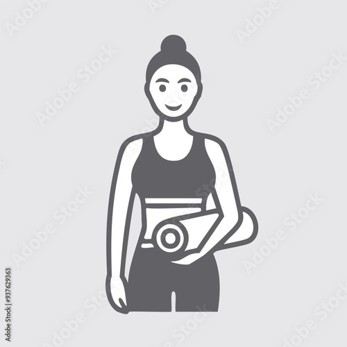 Happy woman holding yoga mat. A smiling female yoga instructor in workout clothes holding a rolled-up yoga mat.