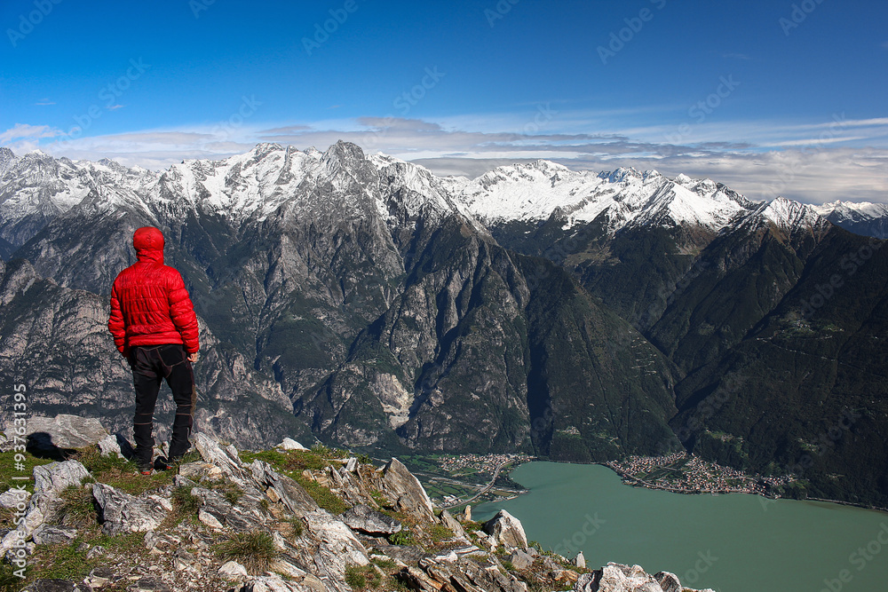 On mountain peak with Alps and Novate Mezzola lake on background, Italy landscape On mountain peak with Alps and Novate Mezzola lake on background, Italy landscape