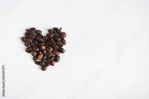 coffee beans with heart - shaped on a white background photo