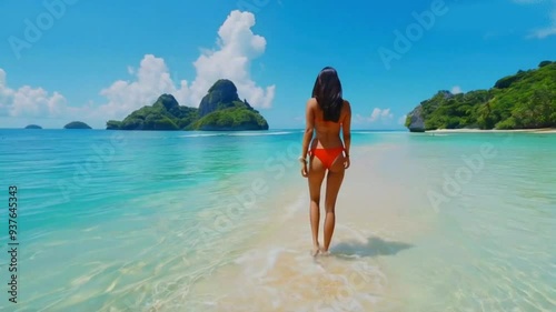 Exotic Woman in red Bikini Walk to Ocean in beautiful sea water. Concept of vacation, holiday, Tourism and recreation. Charming cute Asian woman travel around islands. girl enjoy life and has High qua photo