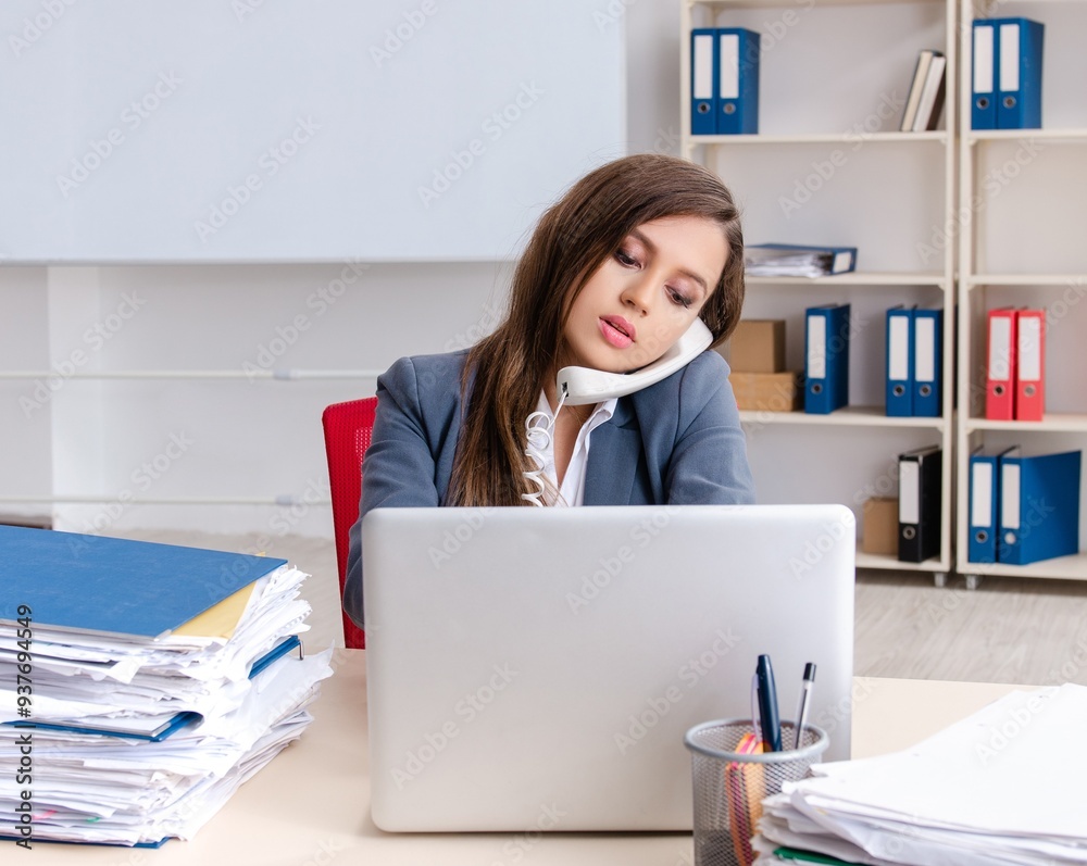 Beautiful female employee unhappy with excessive work