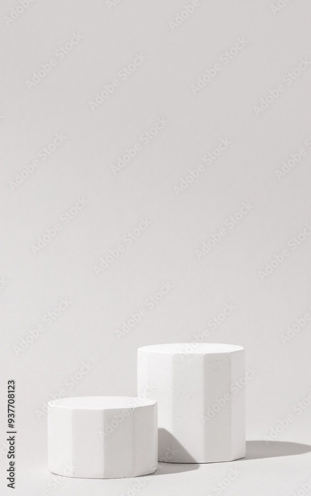 Cosmetics product presentation background scene made with two white pillars podium in sunlight. Ideal for showcasing cosmetics, perfumery, jewelry and modern branding visuals. Vertical photography. Cosmetics product presentation background scene made with two white pillars podium in sunlight. Ideal for showcasing cosmetics, perfumery, jewelry and modern branding visuals. Vertical photography.