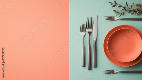 Solid color placemat with minimalist tableware and brushed steel utensils, capturing a clean and modern aesthetic photo