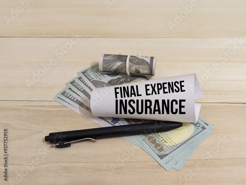 banknotes, pen and fold paper with the word Final Expense Insurance. insurance concept