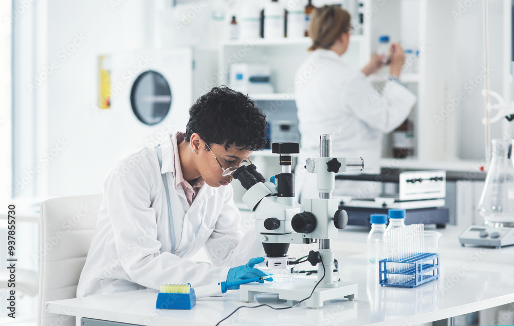 Scientist, research and woman with microscope in laboratory for medical sample, review and innovation. Pharmaceutical, science and biotech with testing for Mpox vaccine, development or clinical trail Scientist, research and woman with microscope in laboratory for medical sample, review and innovation. Pharmaceutical, science and biotech with testing for Mpox vaccine, development or clinical trail