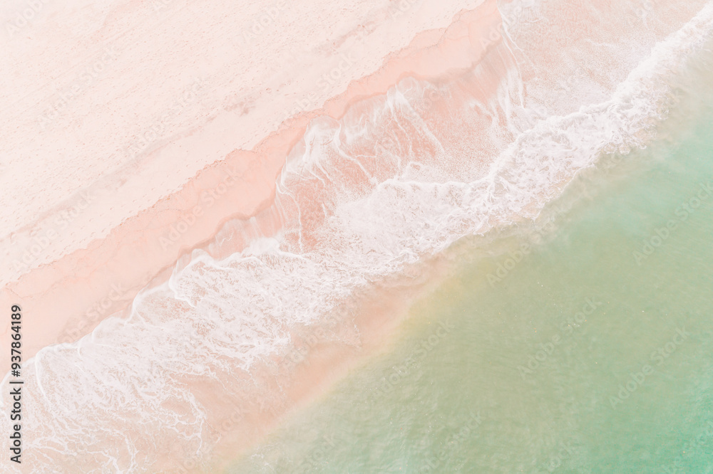 Fototapeta premium drone aerial view of an empty beach at sunrise, background for a summer concept.