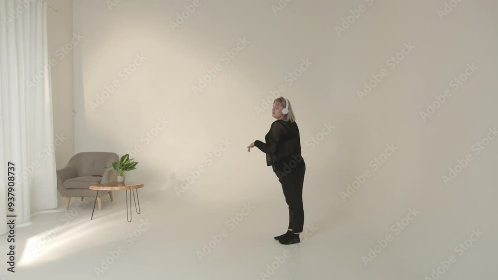 A chic model exuding elegance while posing gracefully in a minimalist studio for a shoot A chic model exuding elegance while posing gracefully in a minimalist studio for a shoot