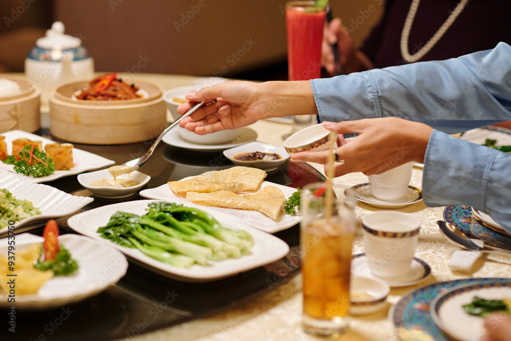Close-up of woman eating sauce with food at dining table Close-up of woman eating sauce with food at dining table