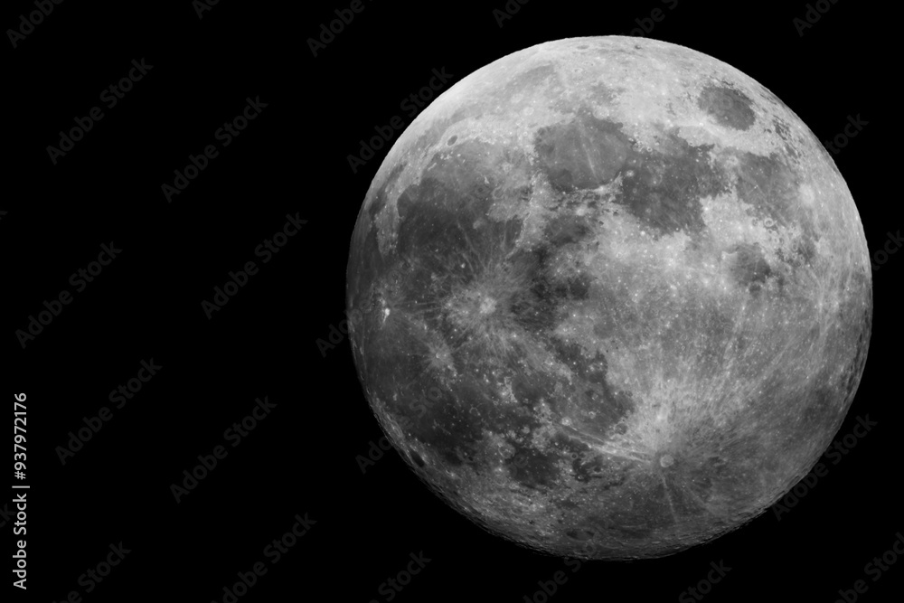 Behold the stunning full moon that shines brightly against the dark, expansive night sky Behold the stunning full moon that shines brightly against the dark, expansive night sky