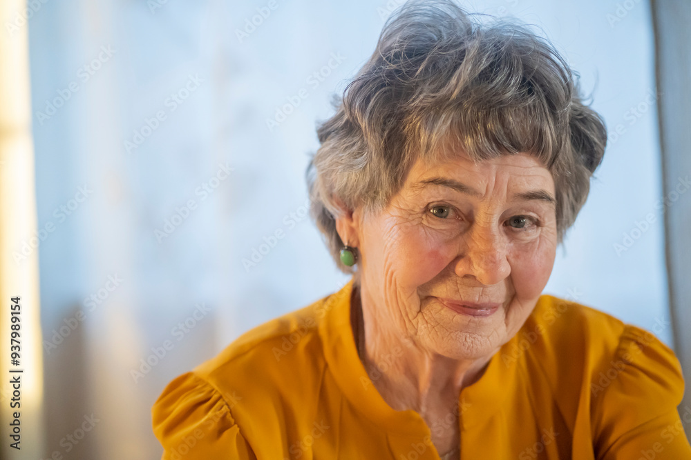 Old retired gray-haired woman in yellow blouse. Old retired gray-haired woman in yellow blouse.