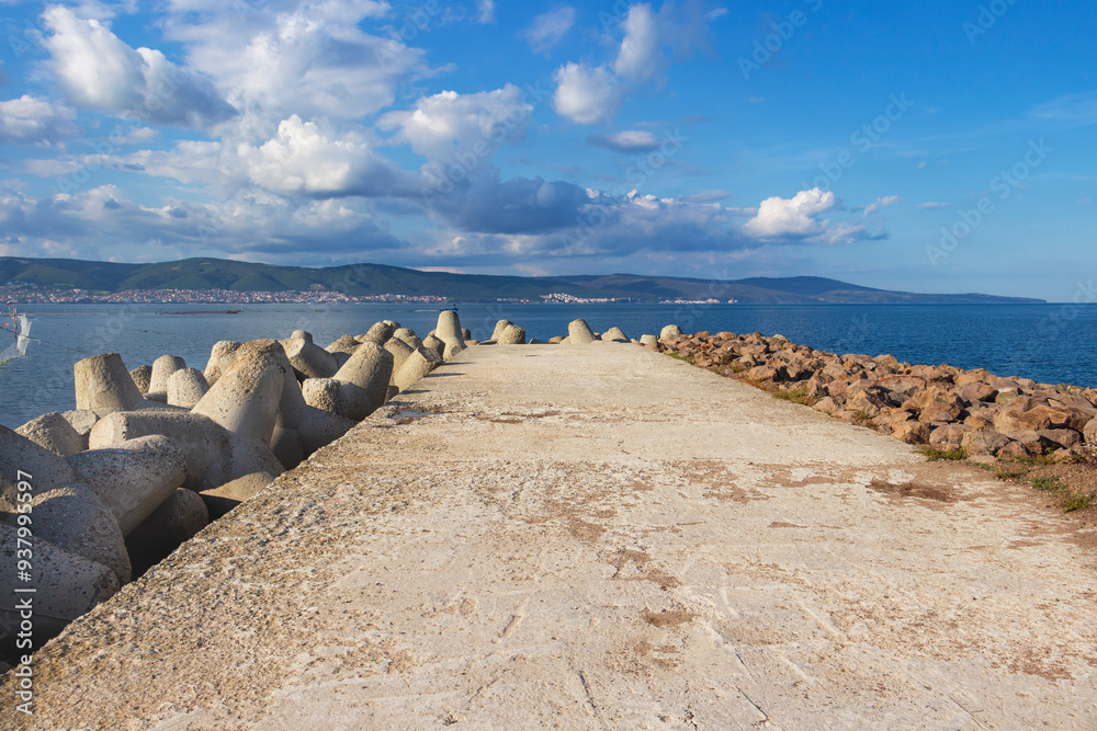 Concrete pier with tetrapods and breakwater stones at the Nesebar sea port in Old Town Nesebar, Burgas Province, Bulgarian Black Sea coast Concrete pier with tetrapods and breakwater stones at the Nesebar sea port in Old Town Nesebar, Burgas Province, Bulgarian Black Sea coast
