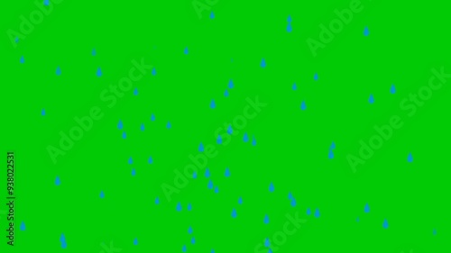 Water drops are raining on green ground surface 