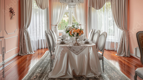 An elegant dining room with a peach pastel background, featuring a long dining table with a white tablecloth, stylish chairs, a centerpiece of fresh flowers