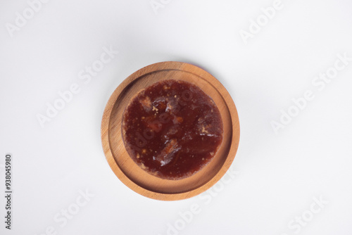 Flat lay style of palm brown sugar on the wooden plate with white background. photo