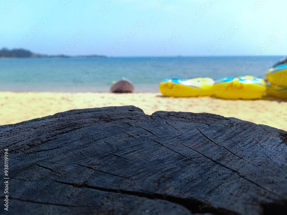 Empty wooden planks with blur beach and canoes on background, can be used for product placement Empty wooden planks with blur beach and canoes on background, can be used for product placement