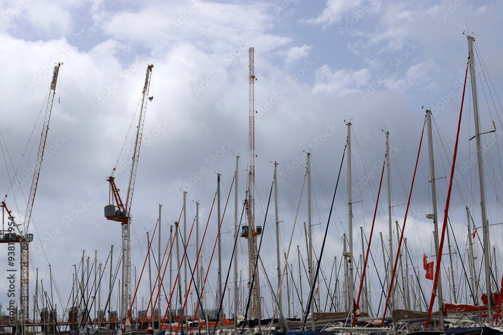 Yachts are moored at the seaport. Yachts are moored at the seaport.